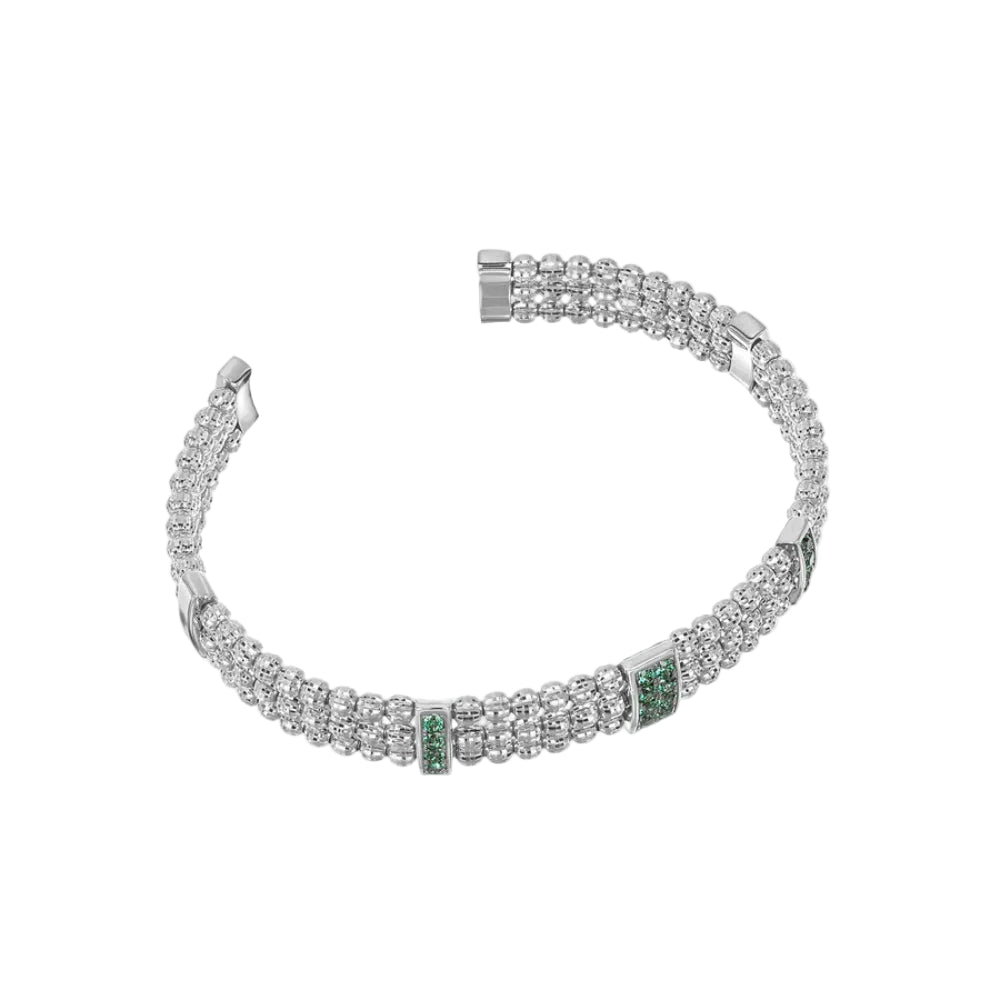 Silver bracelet with green gemstones on a white background