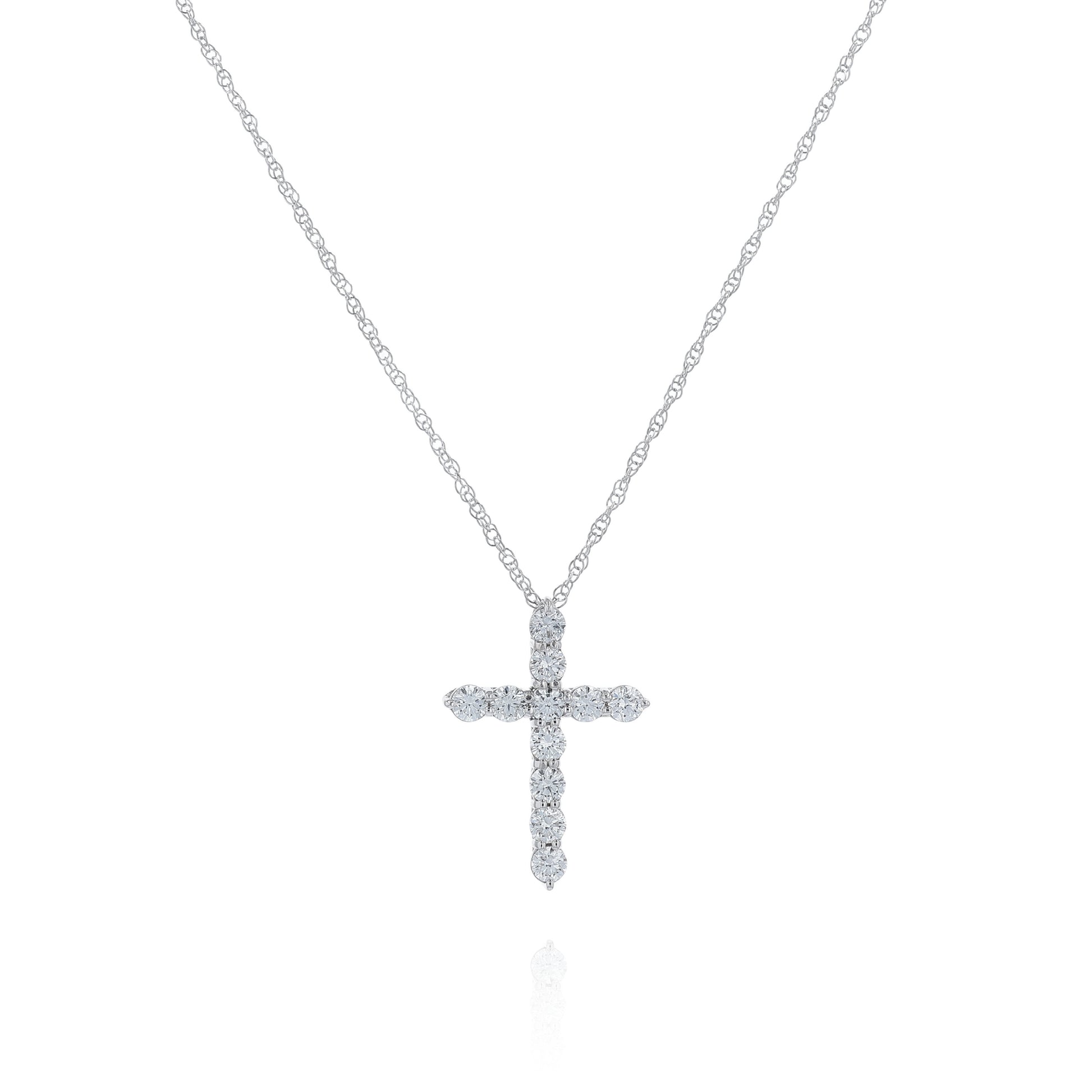 White gold cross pendant necklace with diamonds on a white background