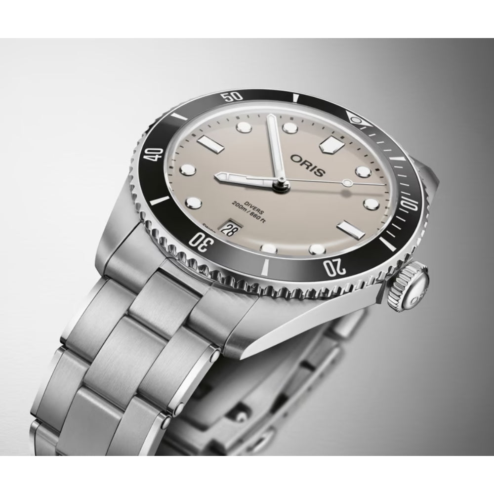 Silver watch with a detailed face on a grey background