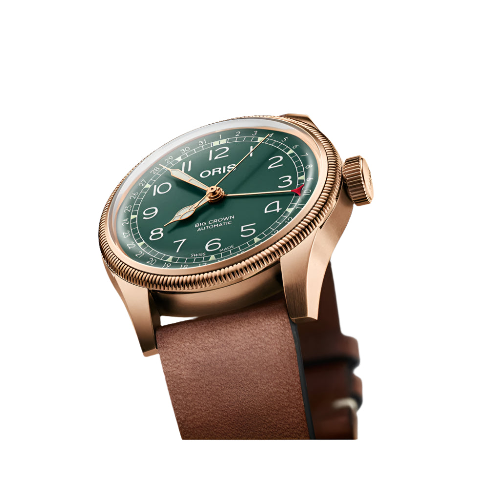 Oris watch with green dial and brown leather strap on a white background