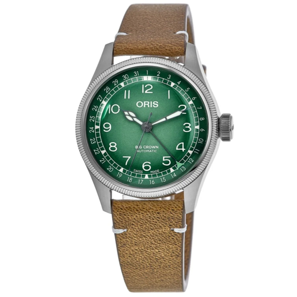 An Oris B&Crown Automatic watch featuring a green dial, silver-tone stainless steel case, and a brown textured leather strap, shown against a plain white background.