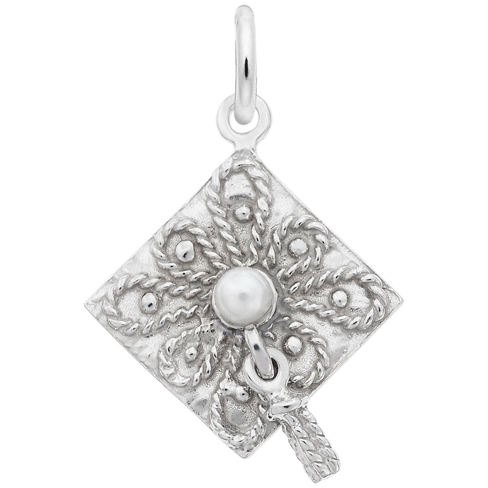 Silver grad cap charm with intricate designs and a pearl on a white background