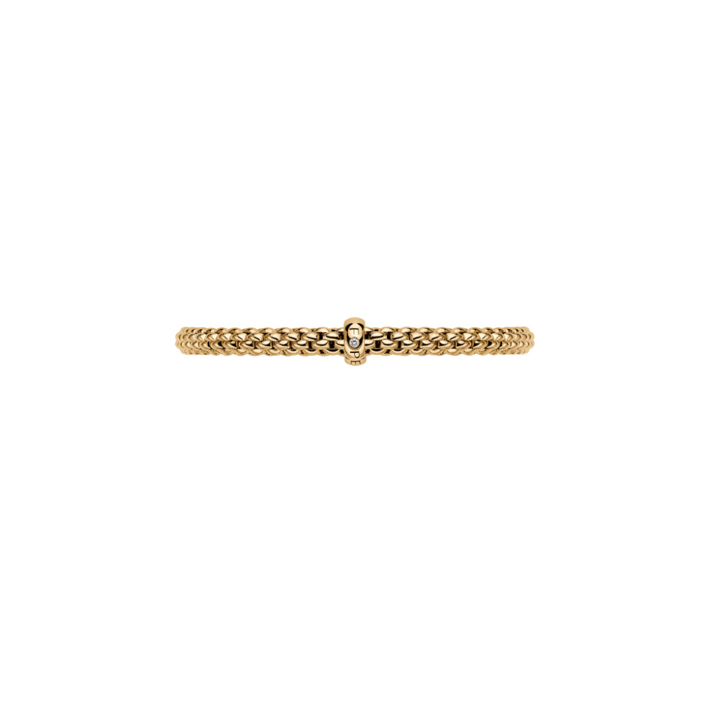 A flexible 18 carat gold bracelet with a single diamond