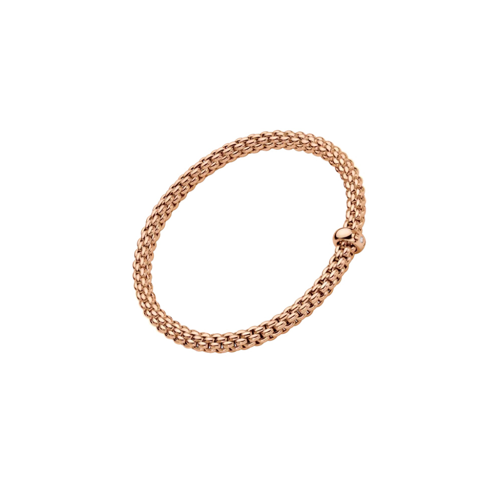 rose gold bracelet on an angle with single clear stone on a white background
