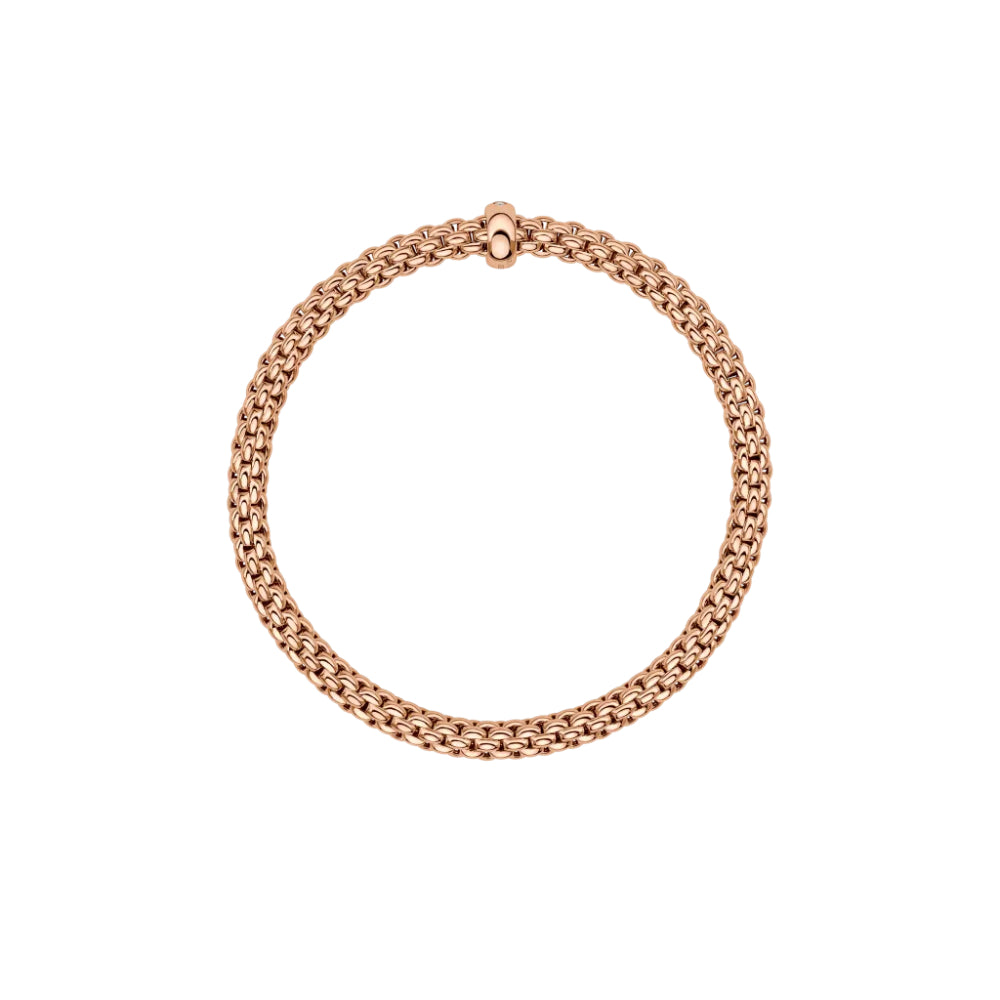 rose gold bracelet on an angle with single clear stone on a white background