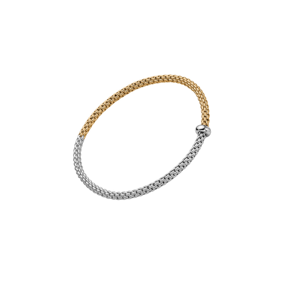 A two-tone metal bangle bracelet with a gold-colored top half and a silver-colored bottom half, featuring a small silver ball clasp, shown on a plain white background.