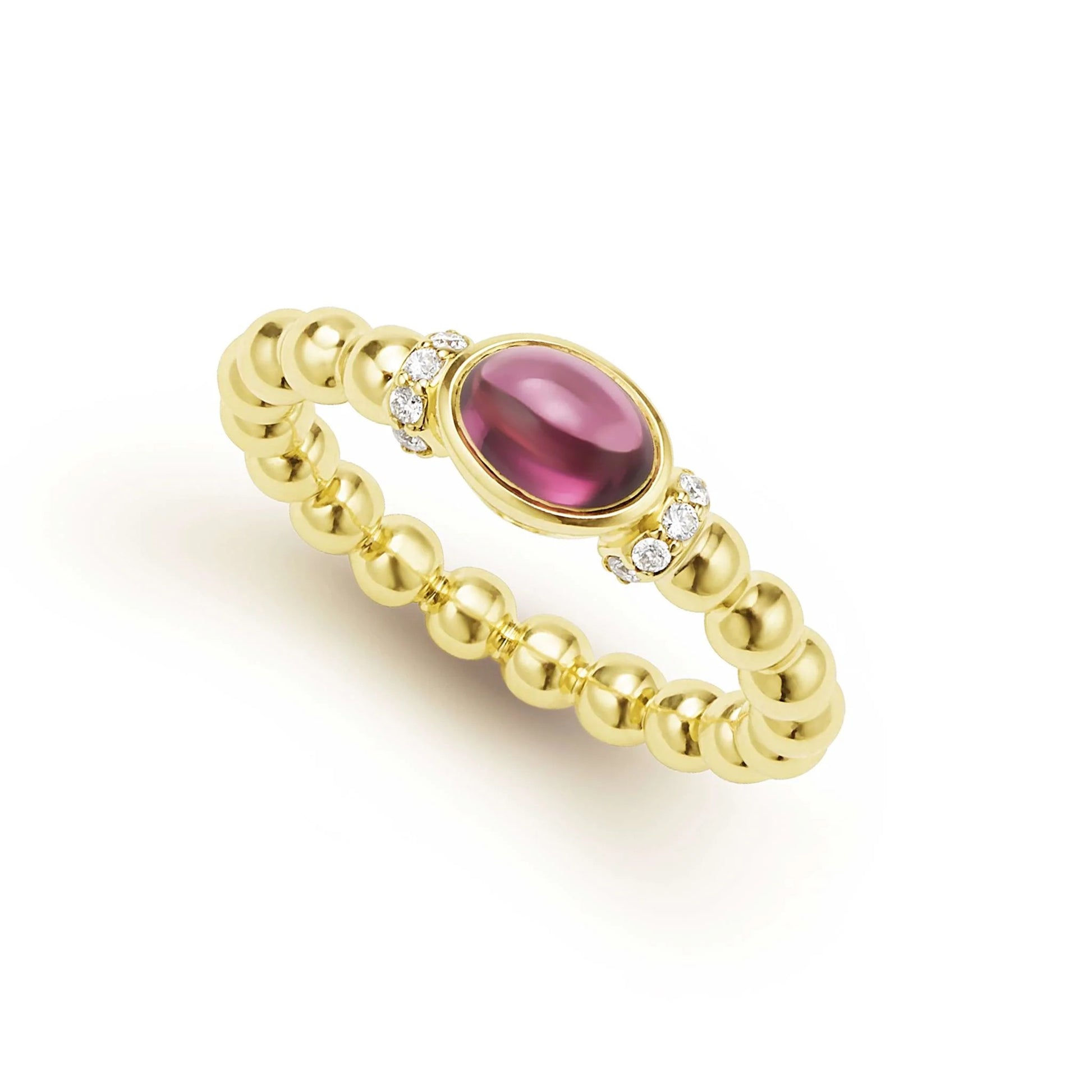 A gold beaded ring featuring a central oval red gemstone accented by small diamonds on either side, set against a plain white background.
