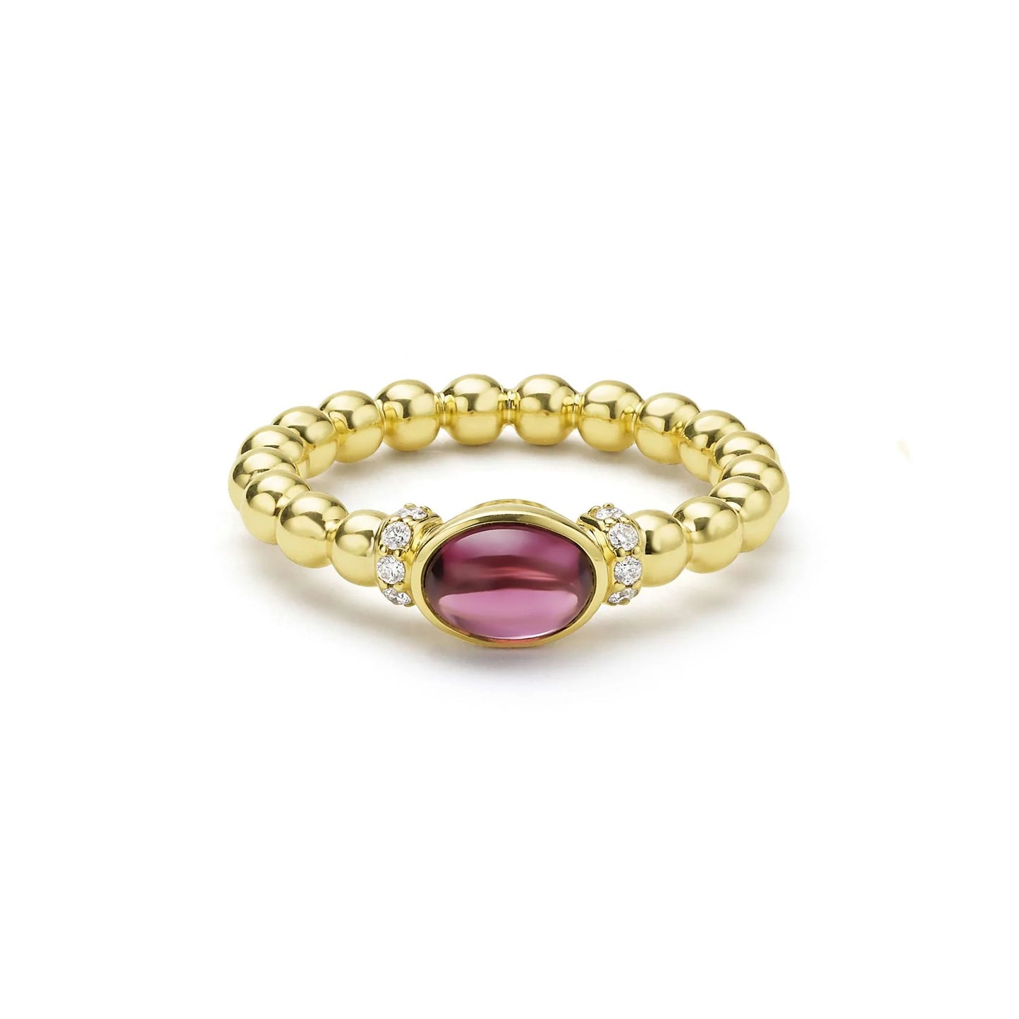 A gold beaded ring featuring a central oval red gemstone accented by small diamonds on either side, set against a plain white background.
