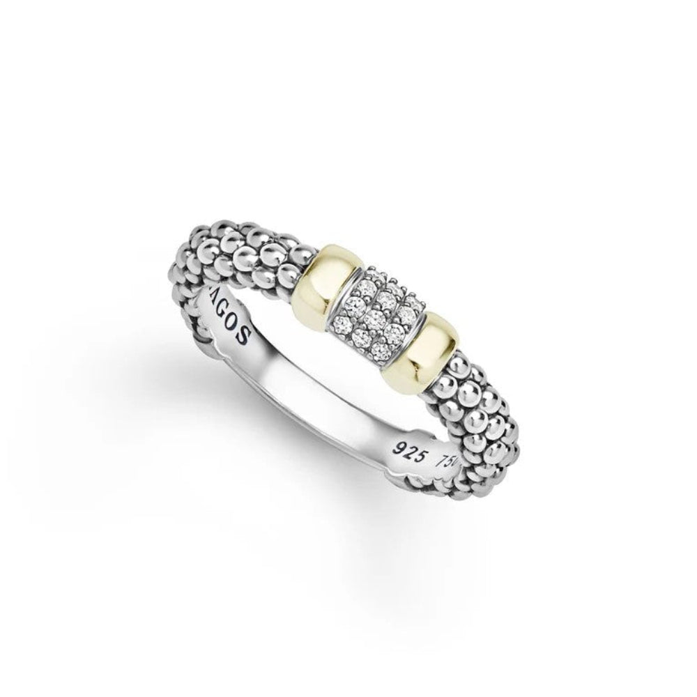 Sterling  silver ring with a textured beaded band, a central pavé diamond section, and two yellow gold cylindrical accents