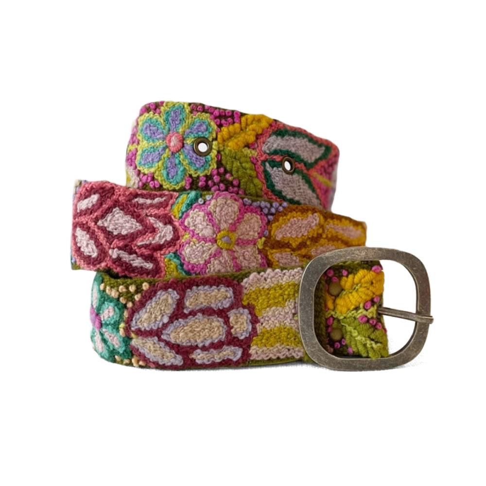 Colorful floral-patterned belt with a metal buckle on a white background