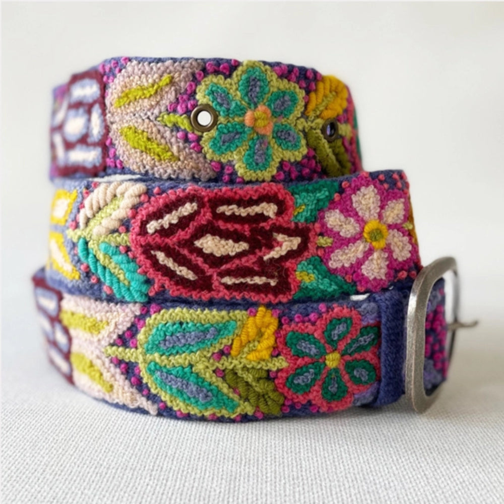 Colorful belt with floral patterns and Superman logo on a white background