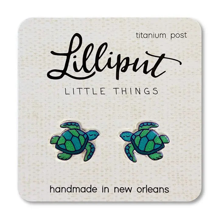 Pair of turtle-shaped earrings on a 'Lilliput Little Things' branded card.