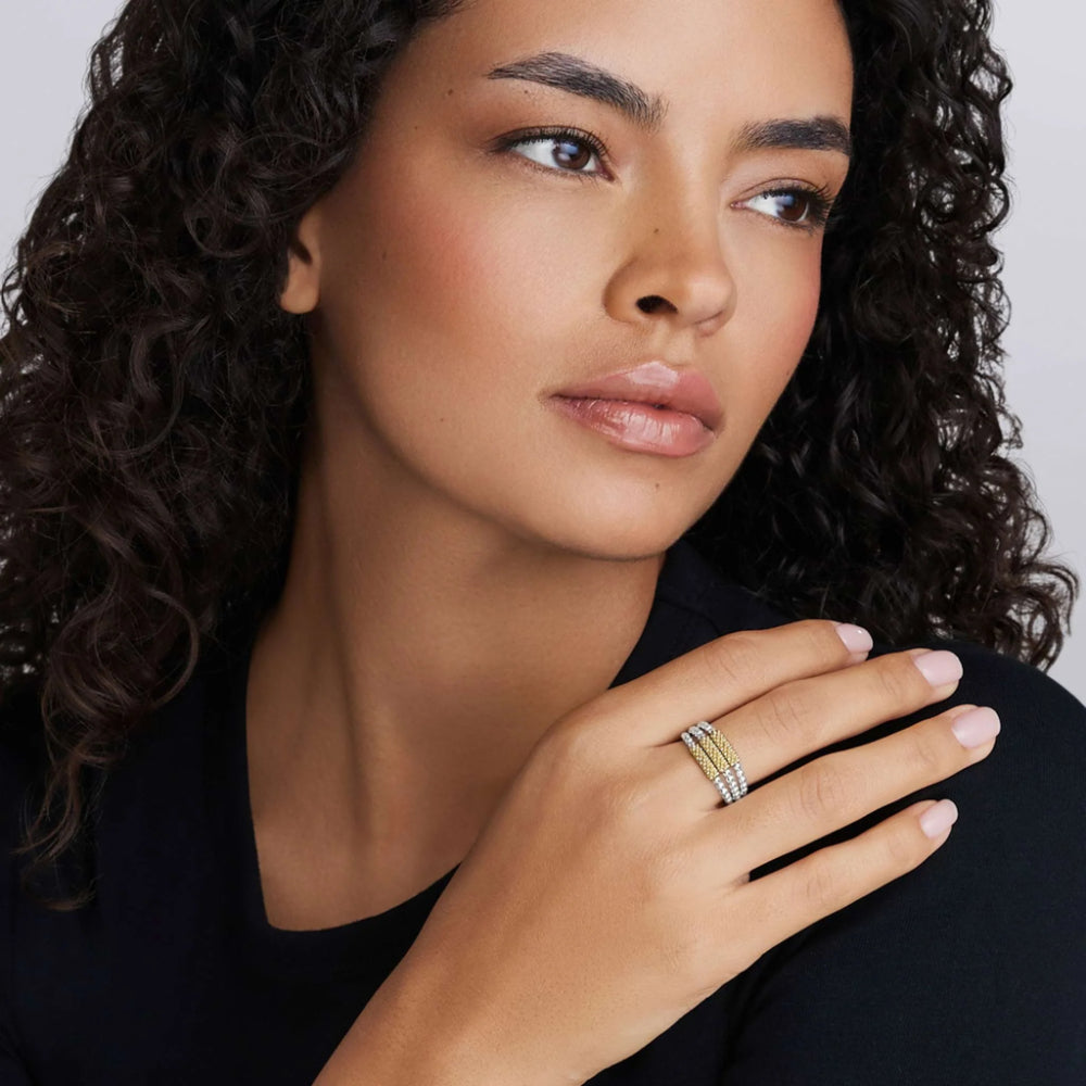 Woman wearing two tone three row ring 