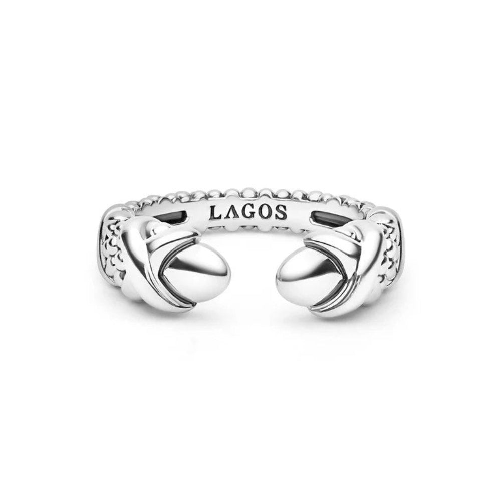 A silver-toned Lagos brand open cuff ring with a textured beaded band and two large  X at the polished end caps 