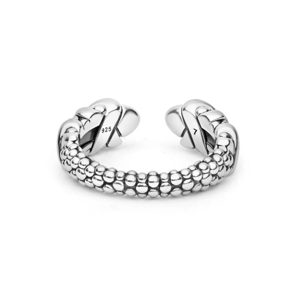 A sterling silver open cuff ring with a textured beaded lower band and sculpted, polished ends