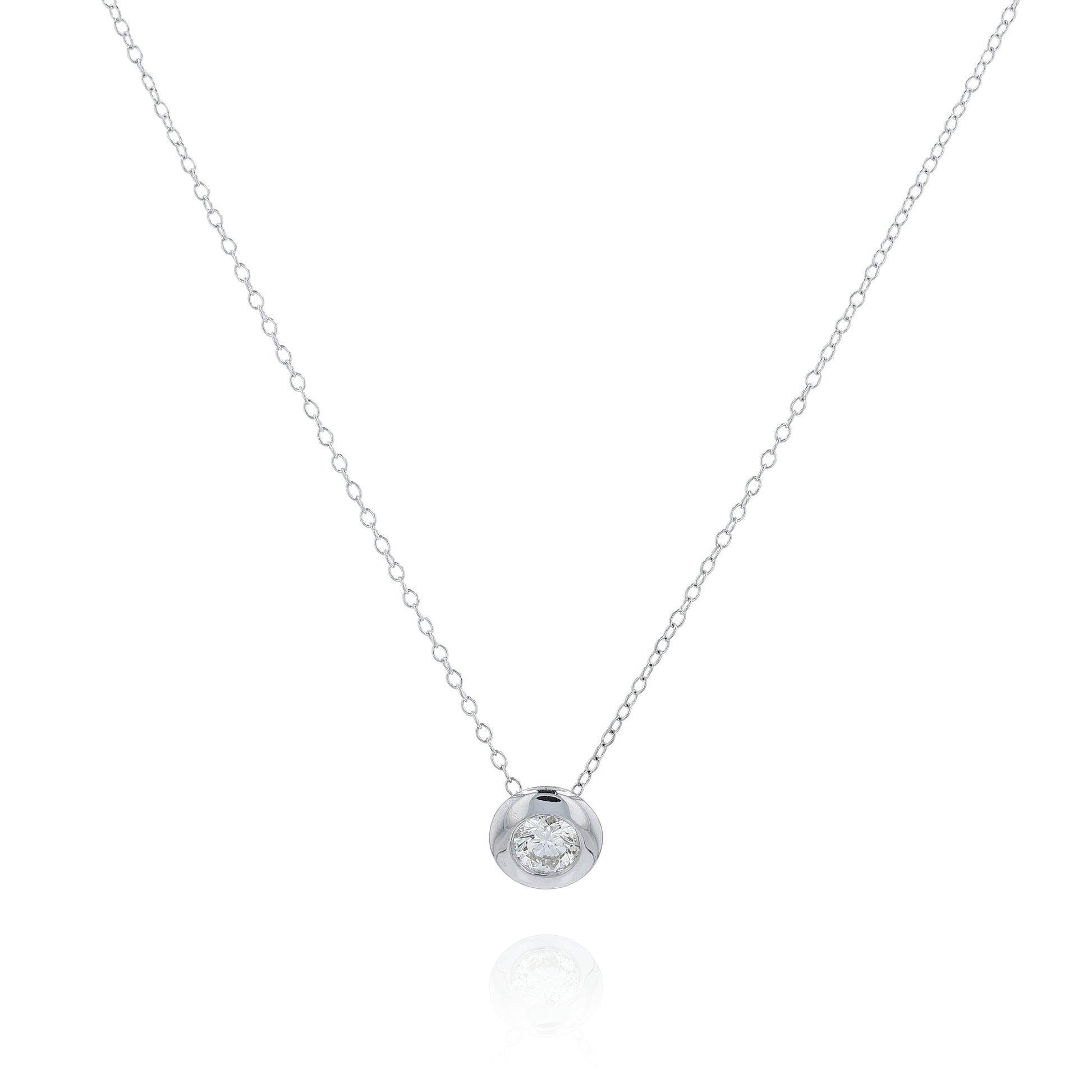 White gold bezel-set diamond pendant necklace on a white background