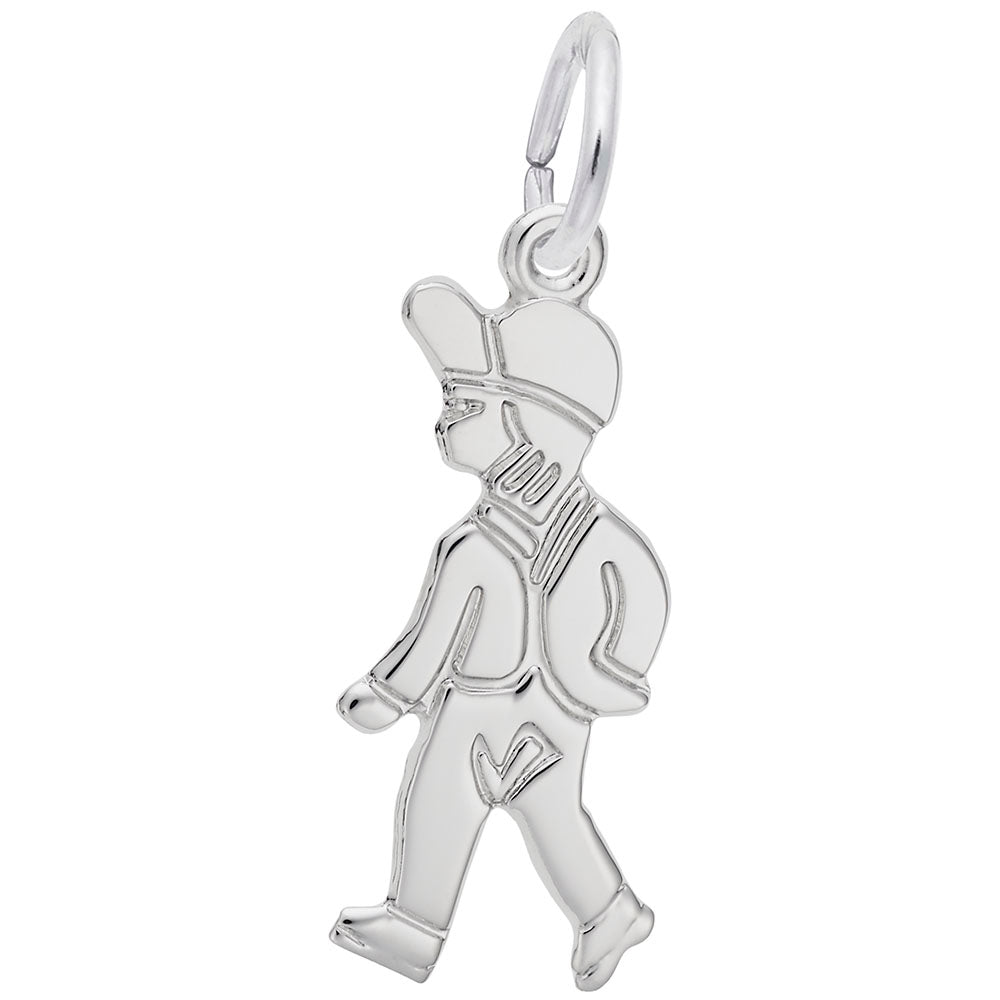 Silver charm of a boy walking on a white background