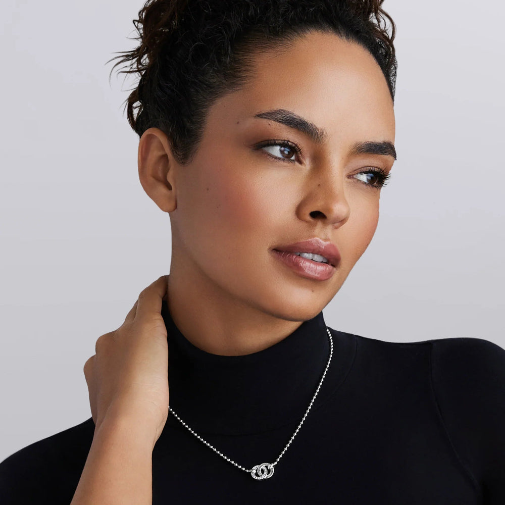 Woman wearing necklace.  Shows beautifully on black colored shirt 