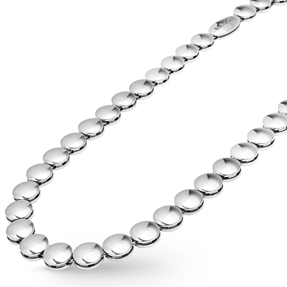 A close-up of a polished silver beaded chain necklace, showing the reflective metallic links arranged diagonally on a clean white background.