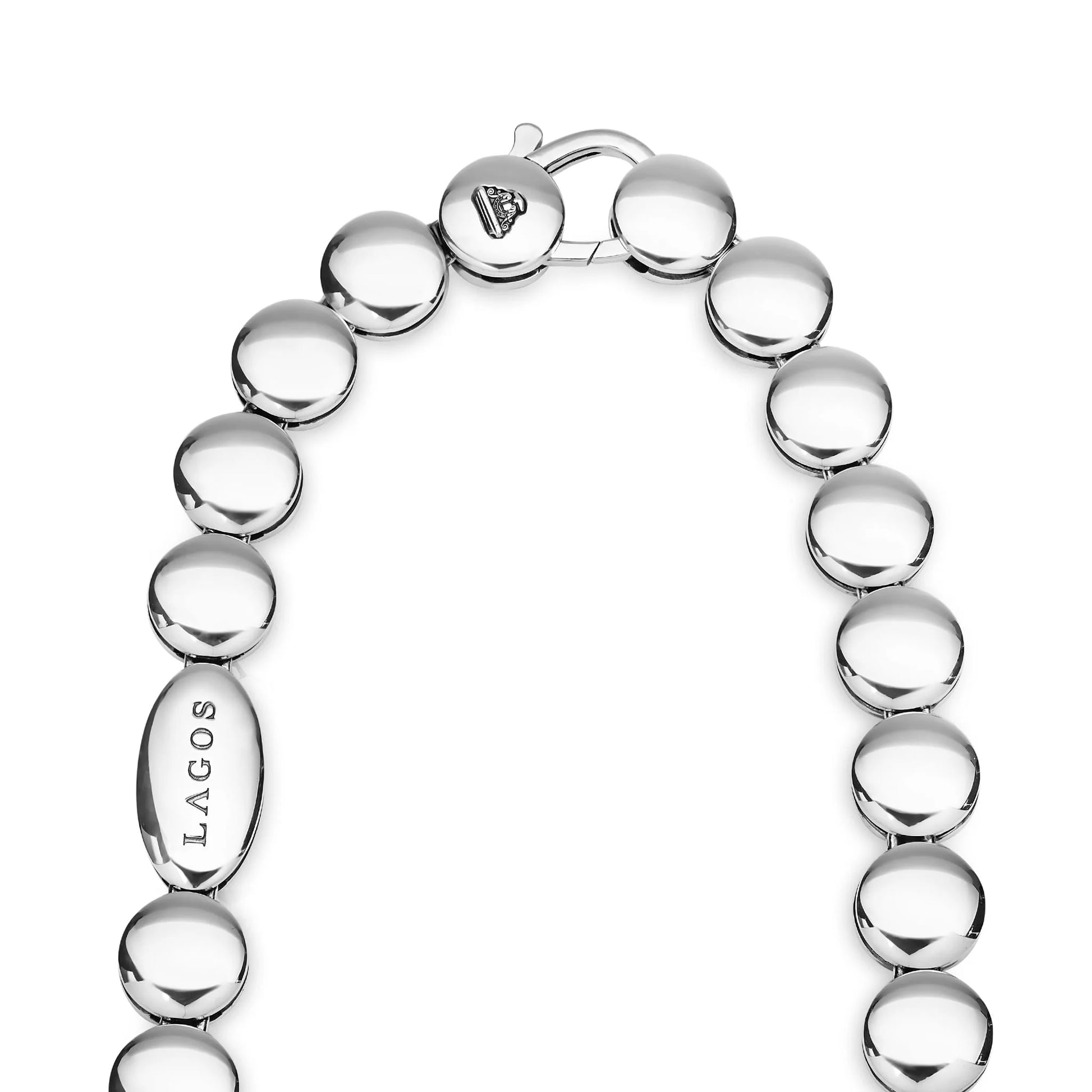 A silver-toned beaded necklace with polished oval links, featuring a flat oval tag engraved with 'LAGOS' and a clasp with a small heart engraving, shown on a white background.