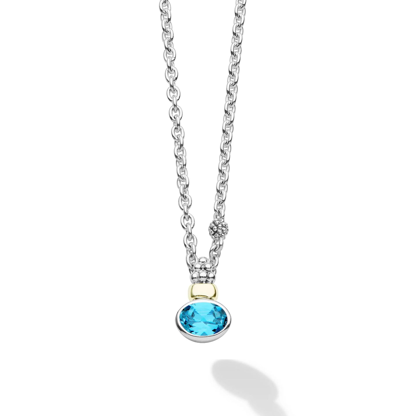 silver tone necklace with blue stone on a white background