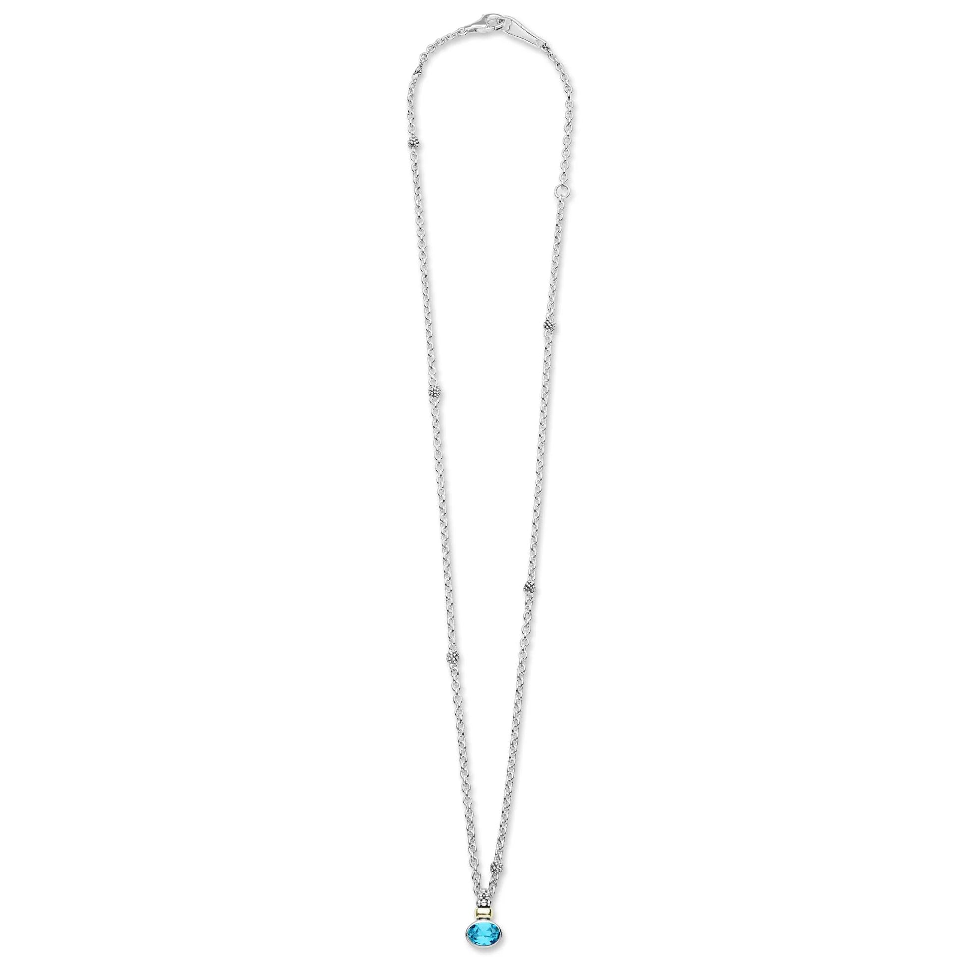 silver tone necklace with blue stone on an angle white background