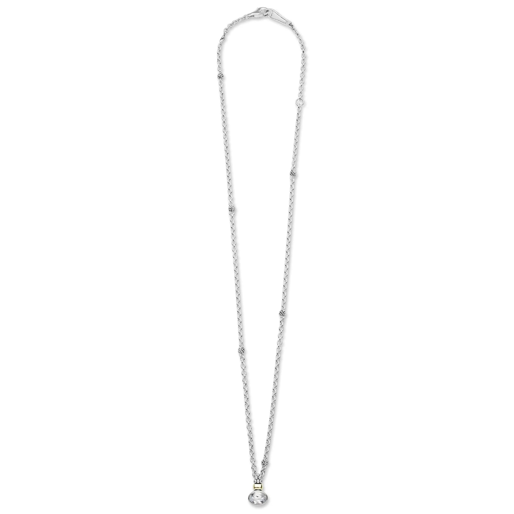 A delicate silver-toned chain necklace with a small heart-shaped pendant, shown against a plain white background.