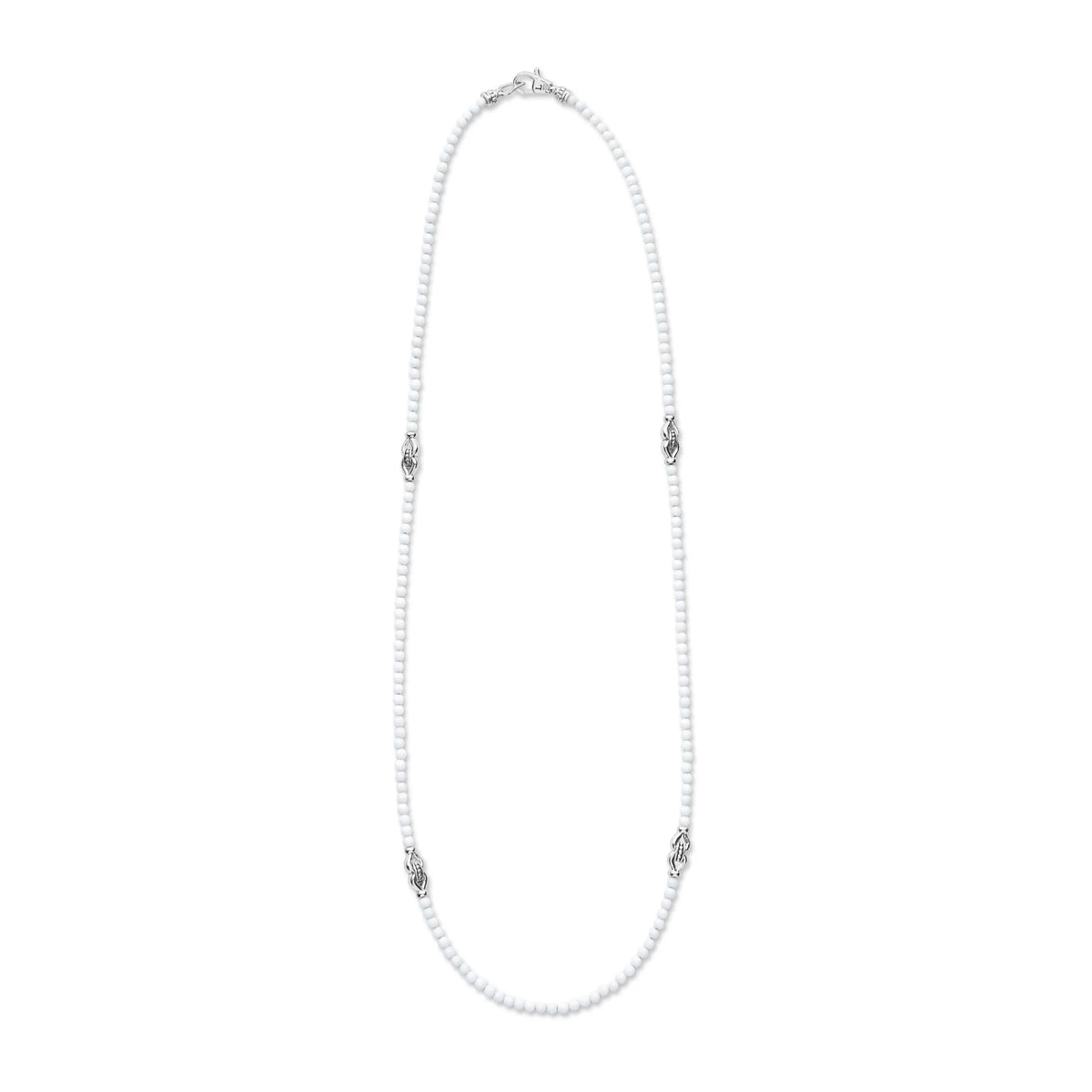 A white pearl necklace with silver-toned decorative spacer beads, displayed on a clean white background.