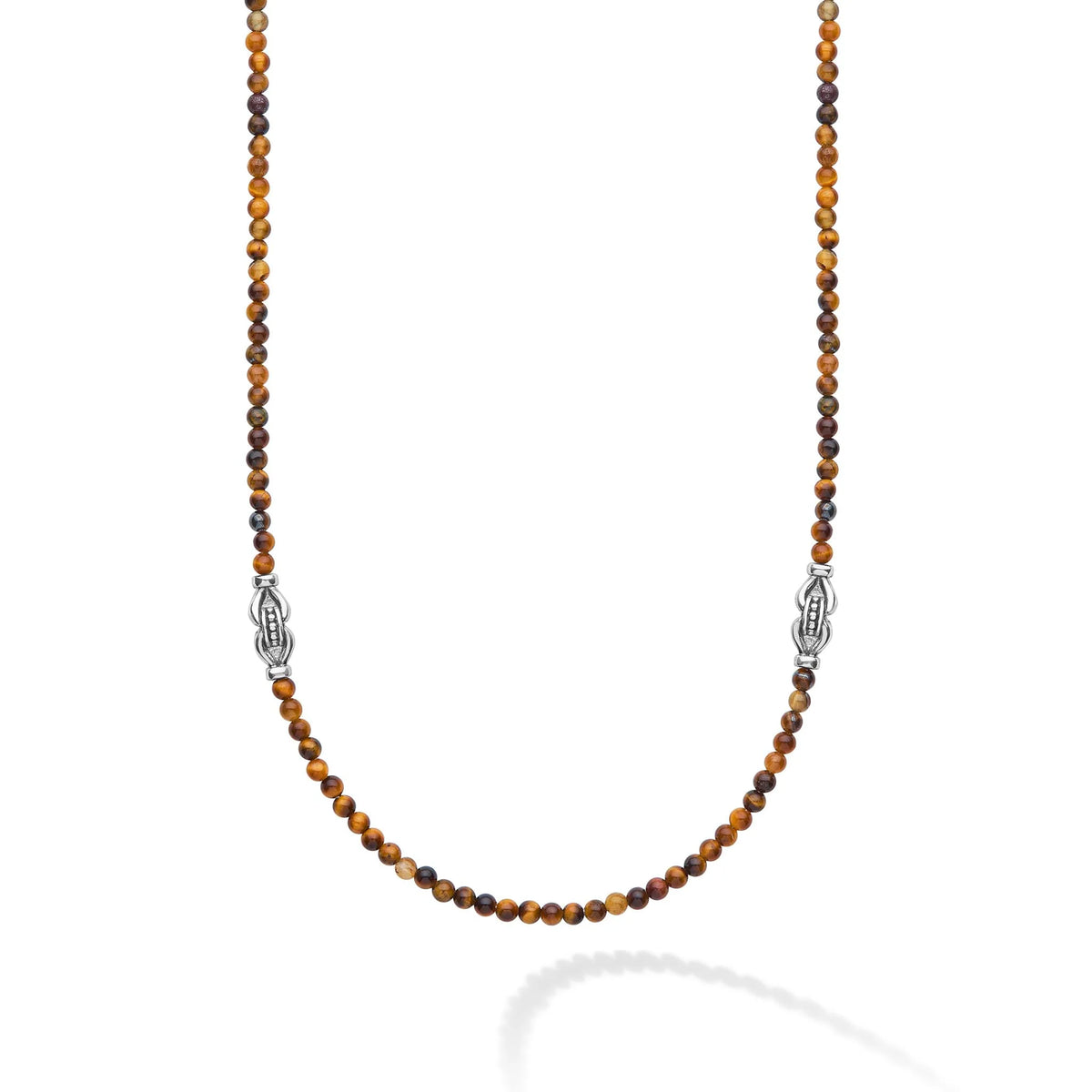 A beaded necklace featuring alternating brown and dark amber tiger's eye beads, accented by two silver-toned Celtic knot spacers, displayed on a clean white background with a soft reflection.
