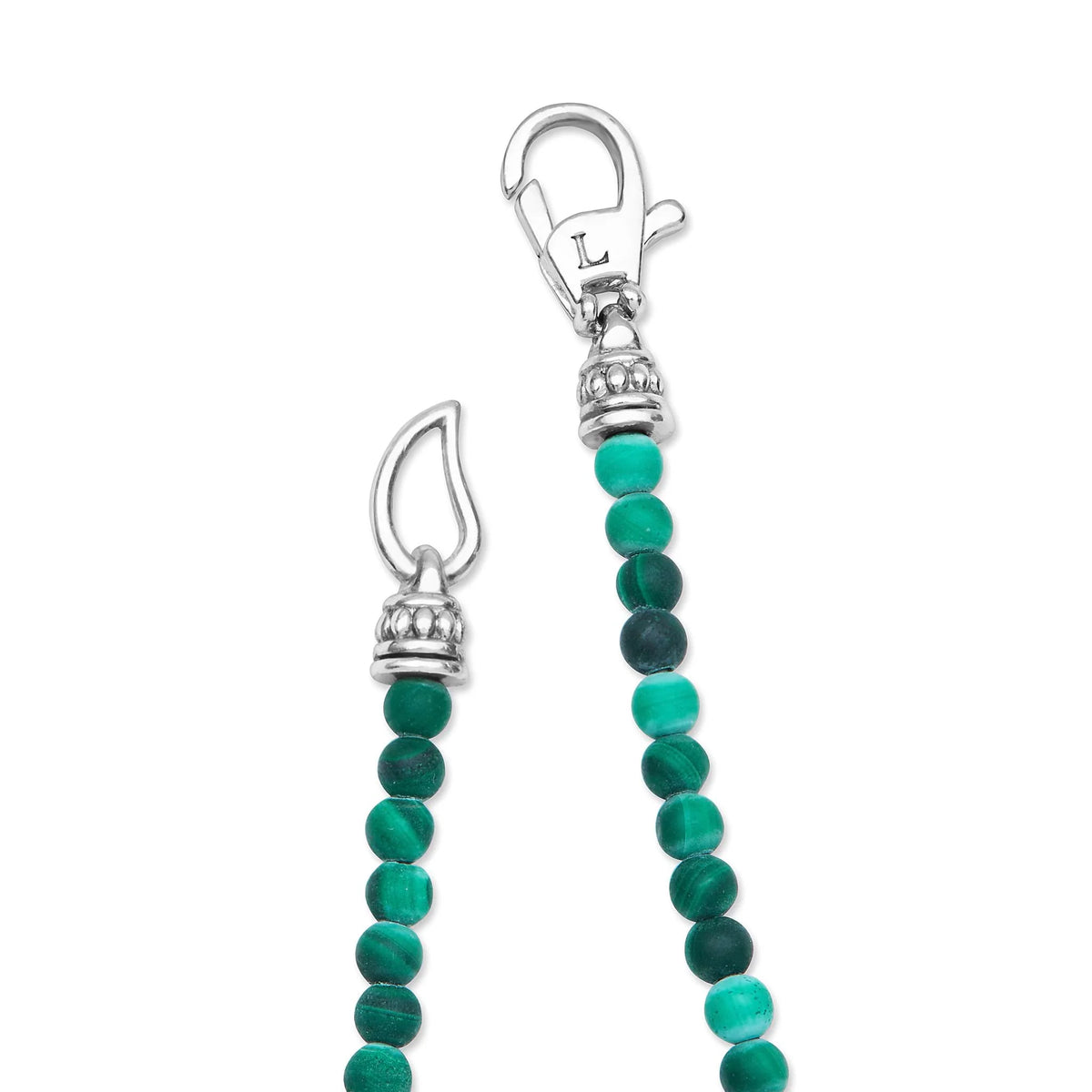 A close-up of a beaded jewelry charm or strap featuring round green beads, including shades of emerald and teal, accented by silver-toned metal caps and a lobster clasp on a plain white background.