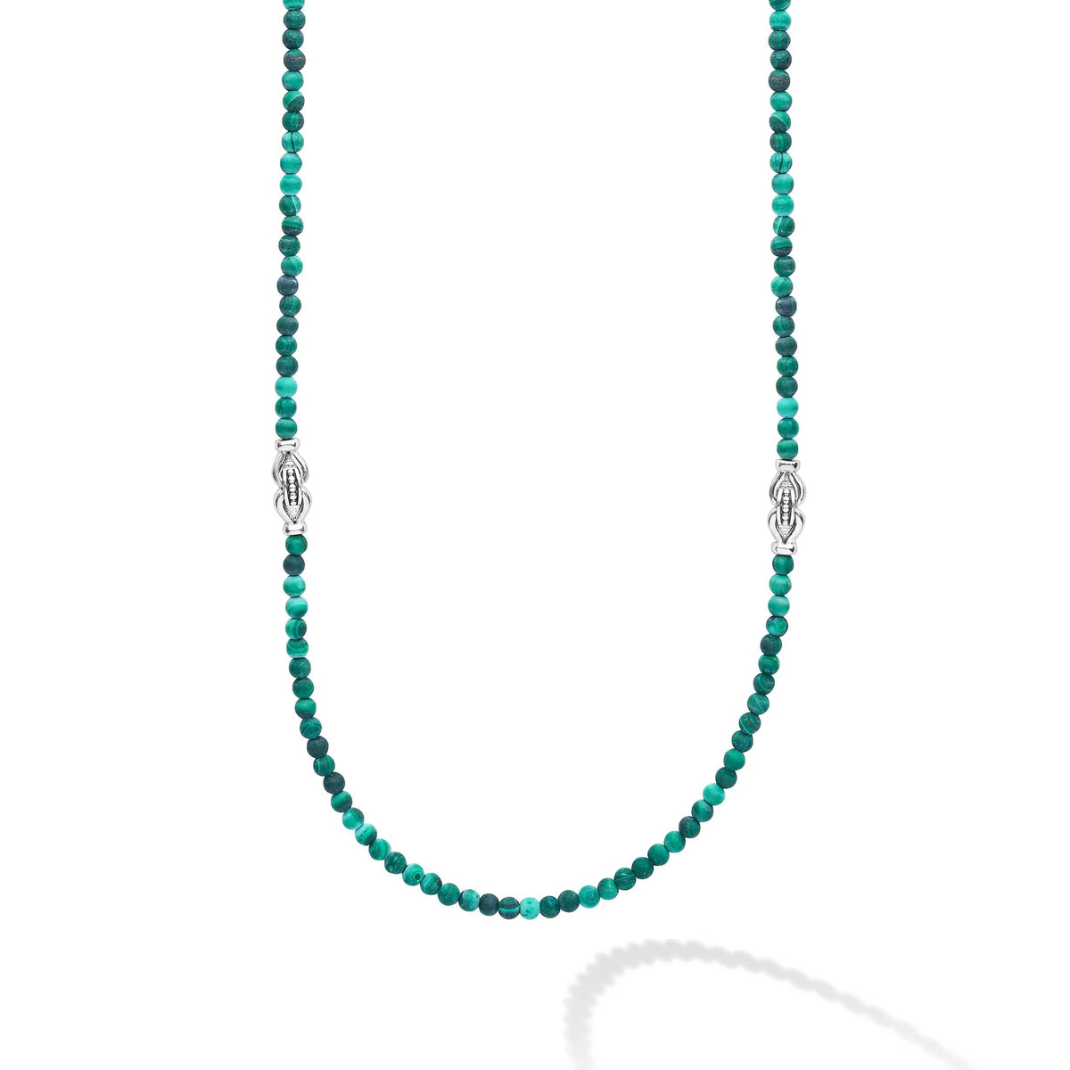 A beaded necklace featuring small faceted green beads with alternating dark and light green strands, accented by silver-toned decorative links, shown on a clean white background.
