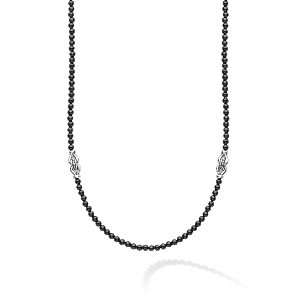 A beaded necklace featuring small, dark round beads and two silver-toned decorative spacer elements, displayed against a clean white background.