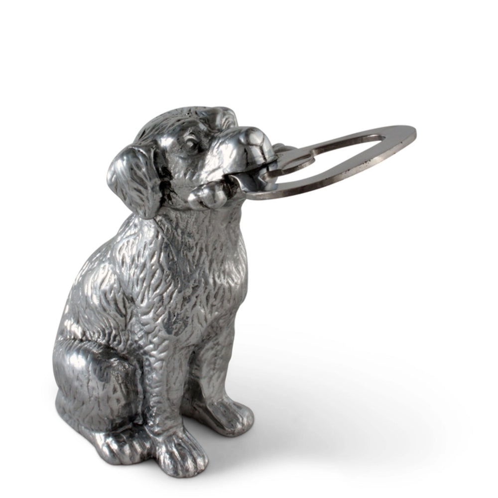 Silver dog-shaped bottle opener on a white background
