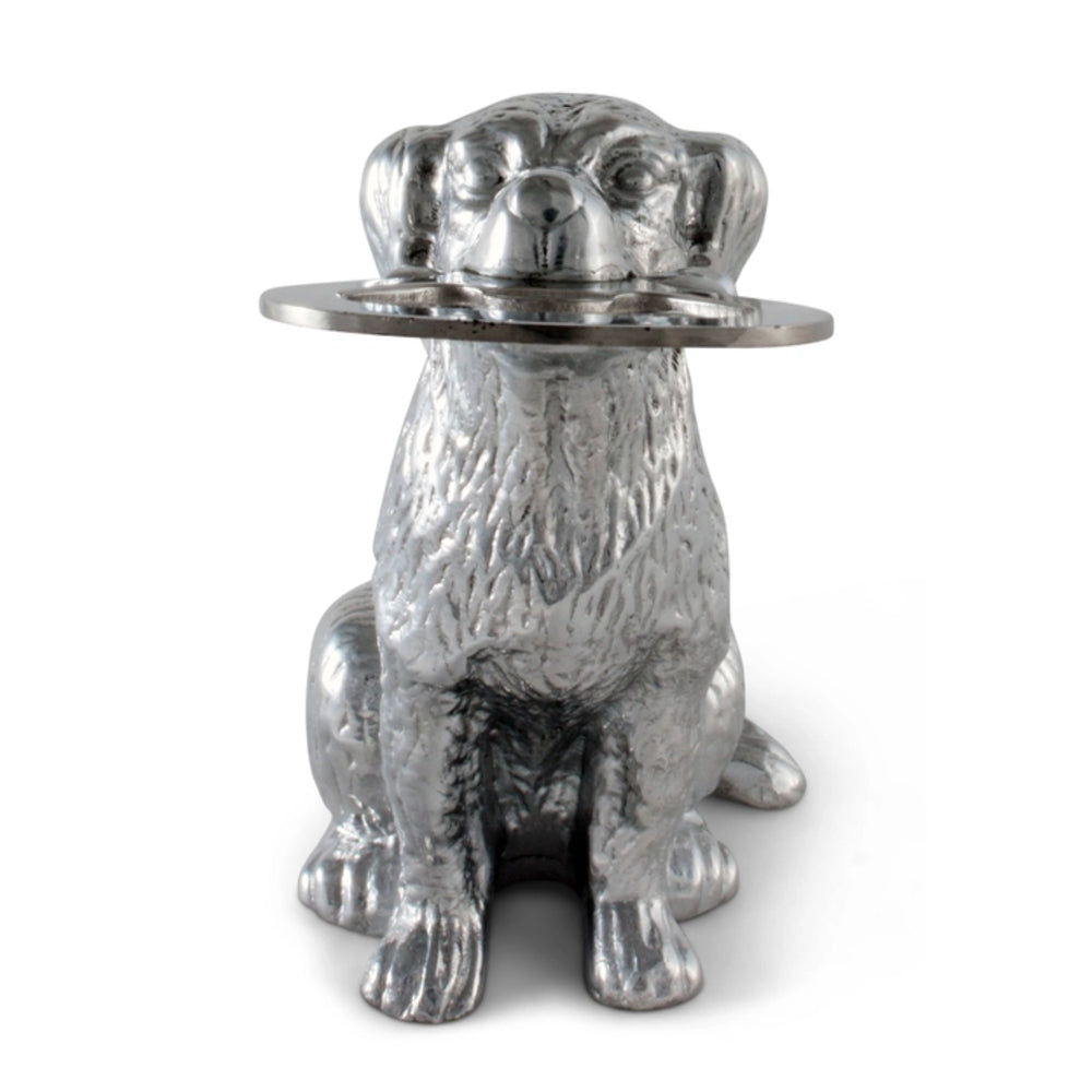 Metallic dog-shaped object with a round platform on a white background
