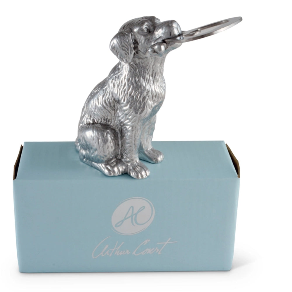 Silver dog-shaped bottle opener on a blue box with 'Athena Court' branding.