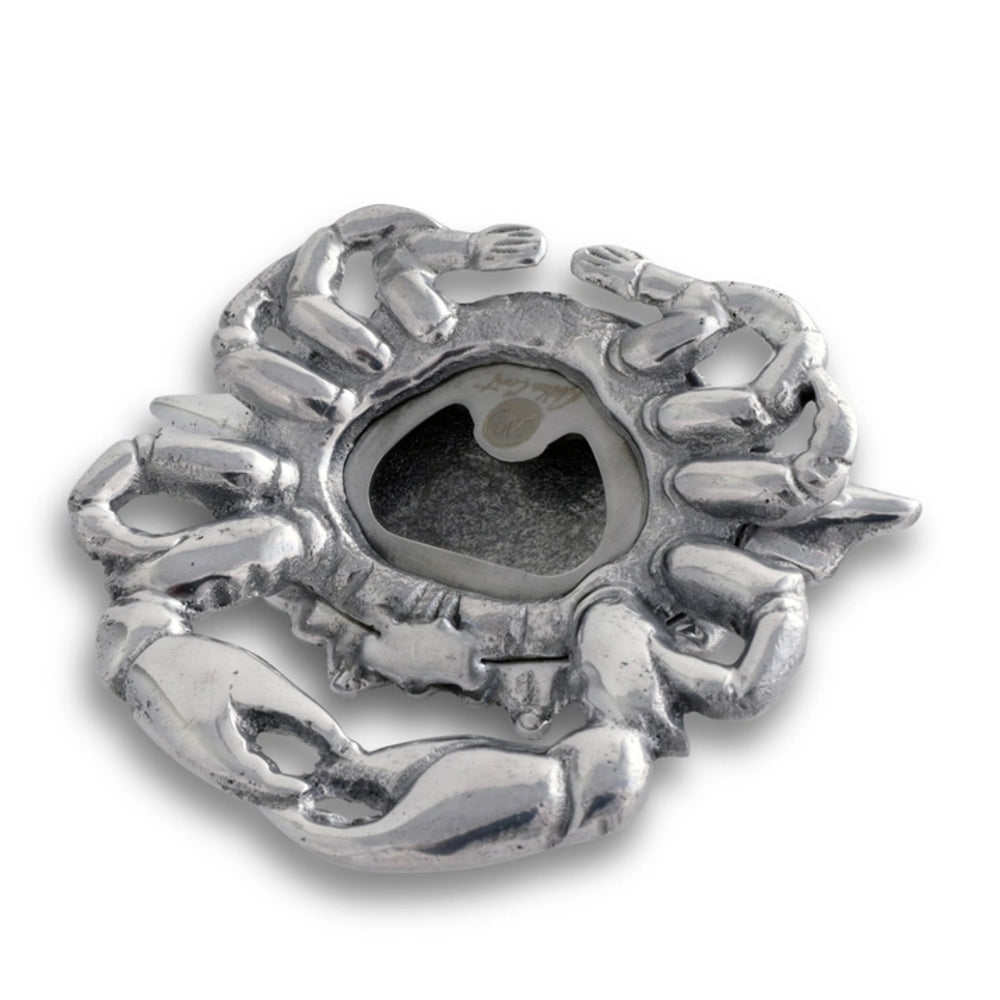 Silver crab-shaped bottle opener on a white background