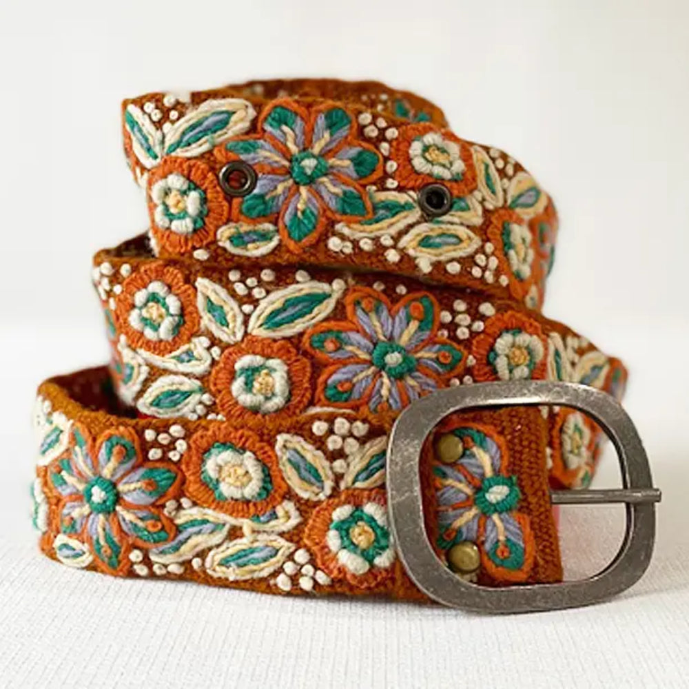 Decorative belt with floral patterns on a white background