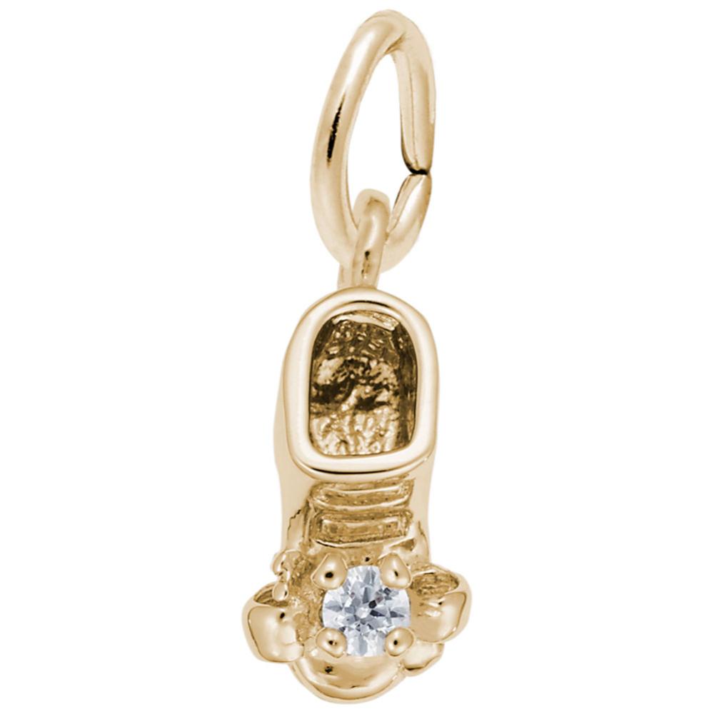 Gold baby-bootie charm with a diamond on a white background