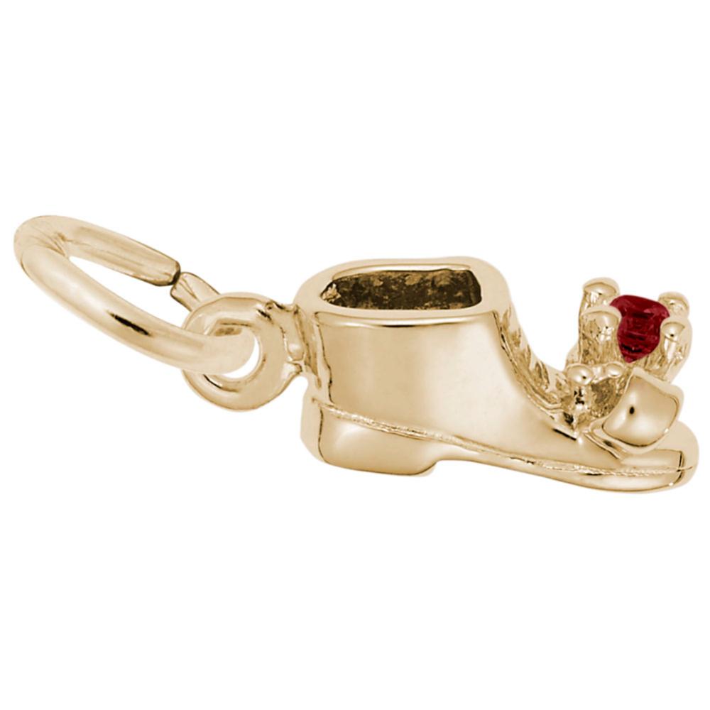Side view of Gold baby-bootie charm with a red gemstone on a white background