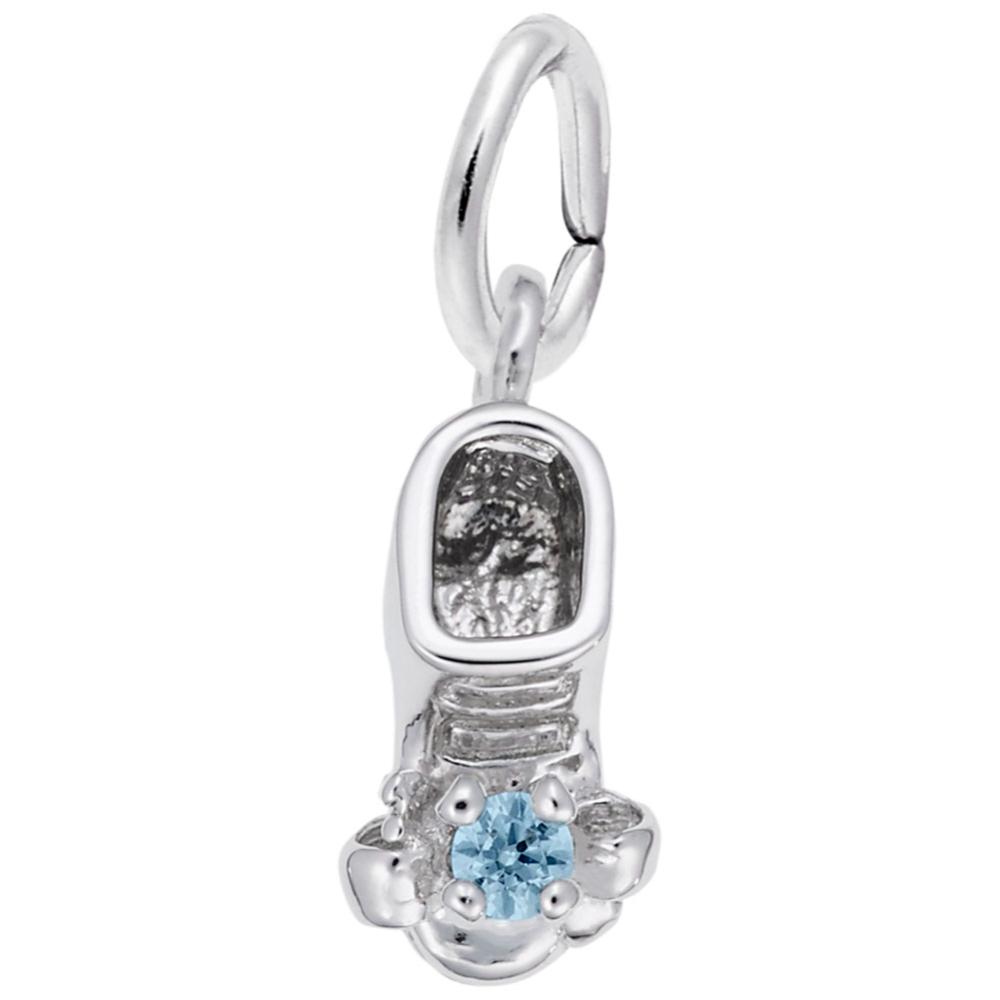 Silver baby-bootie charm with a blue gemstone on a white background