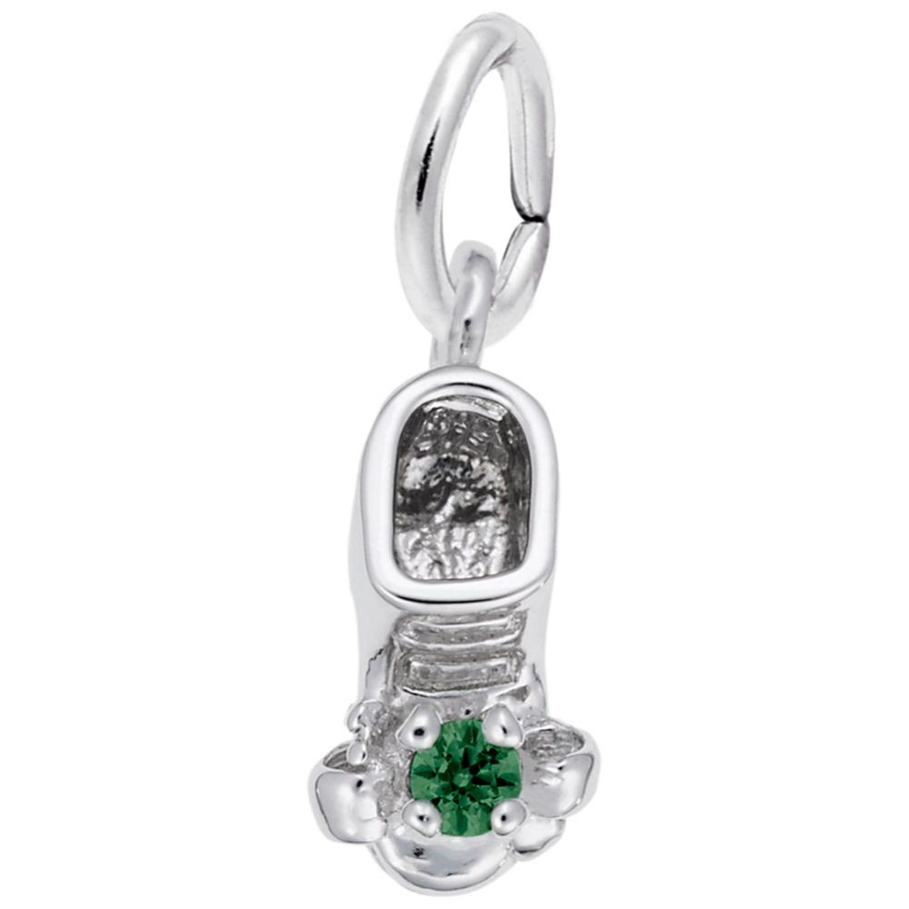 Silver baby-bootie charm with a green gemstone on a white background