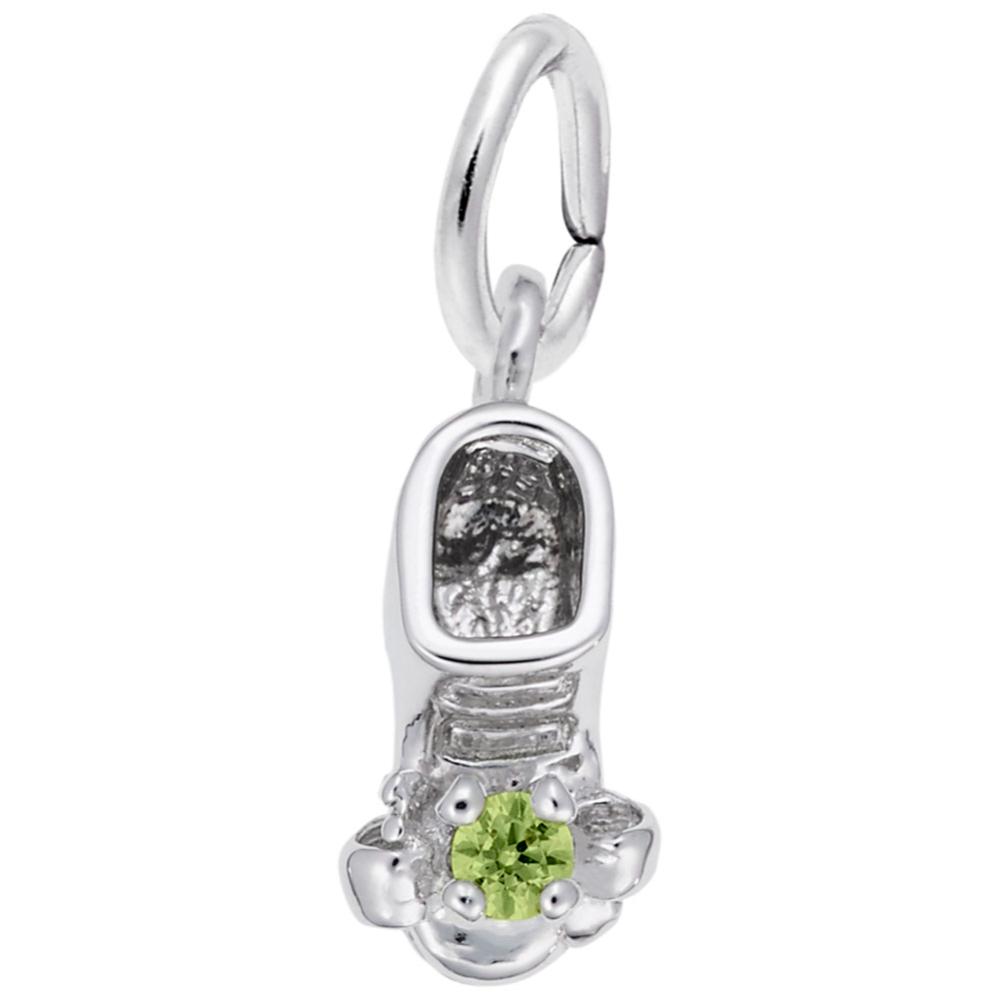Silver baby-bootie charm with a green gemstone on a white background