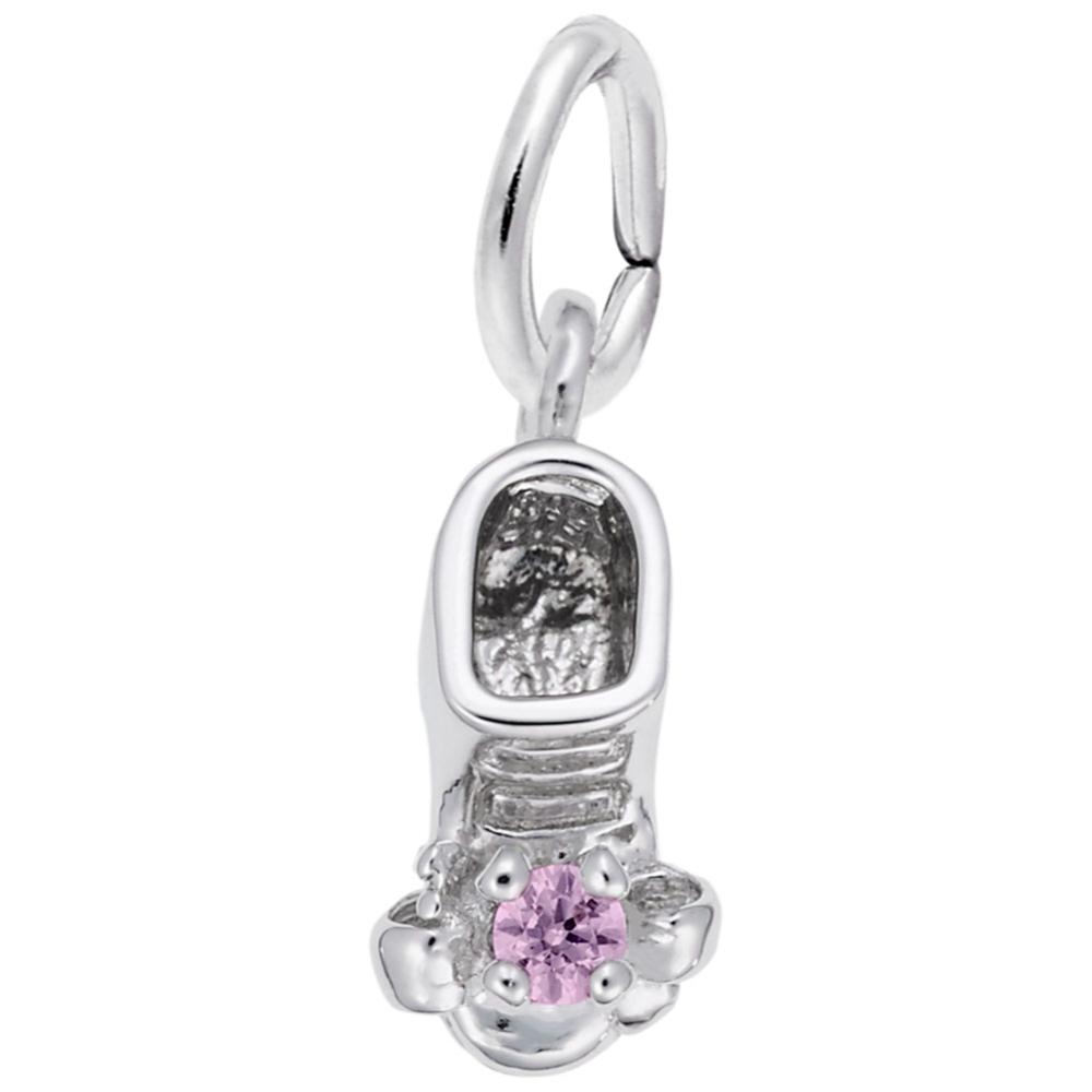 Silver baby-bootie charm with a pink gem on a white background