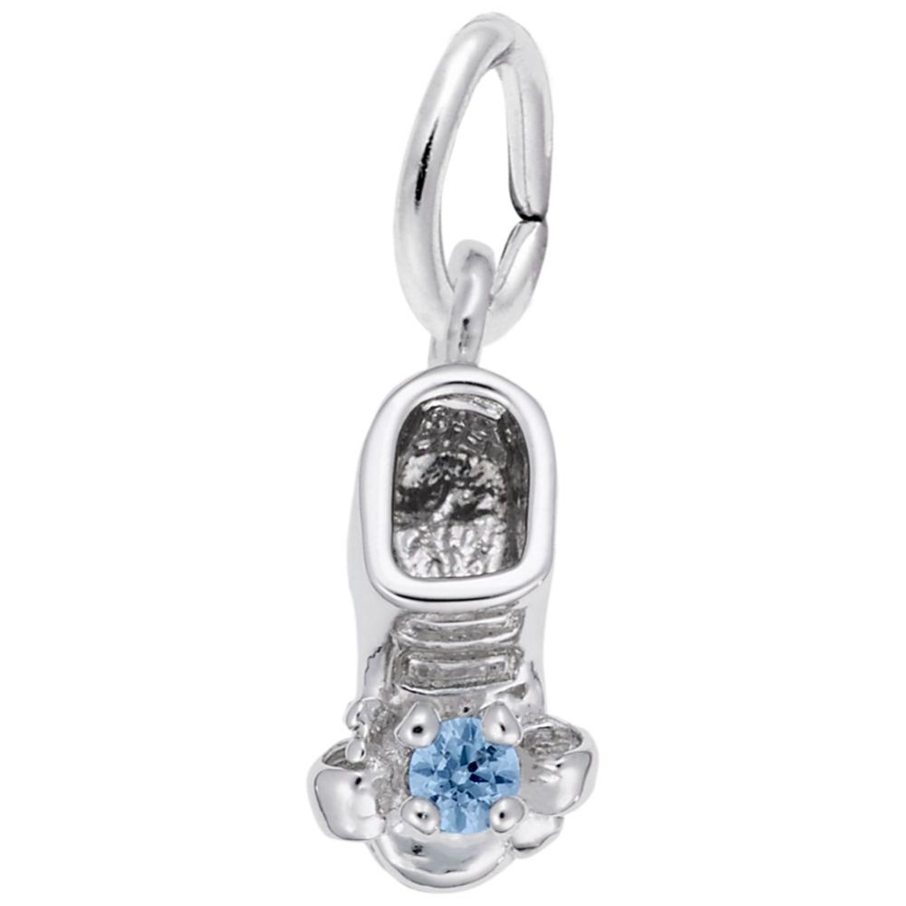Silver baby-bootie charm with a blue gemstone on a white background