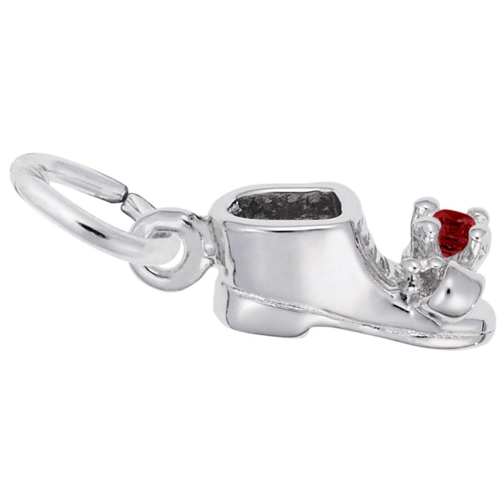 Sideview of Silver baby-bootie charm with a red gem on a white background