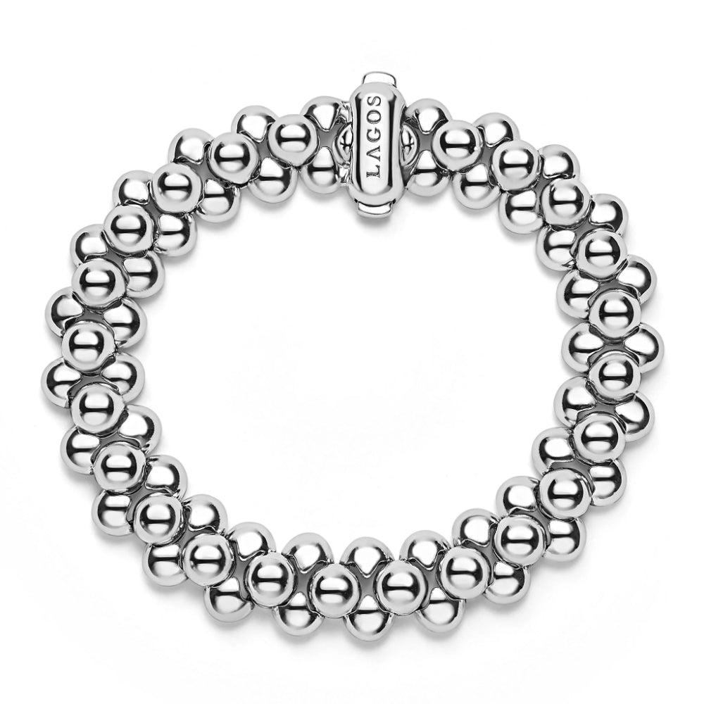 Silver beaded bracelet with a clasp on a white background