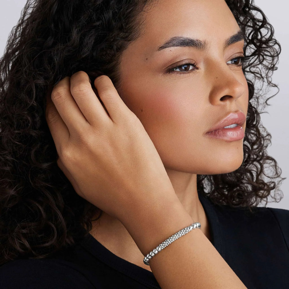 Woman wearing silver stretch bracelet