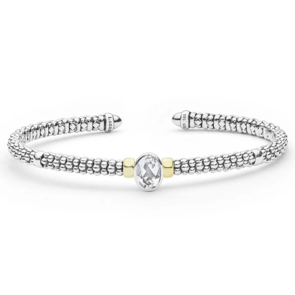 A Sterling silver textured cuff beaded bracelet with a central oval diamond gemstone accented by two small gold-toned beads