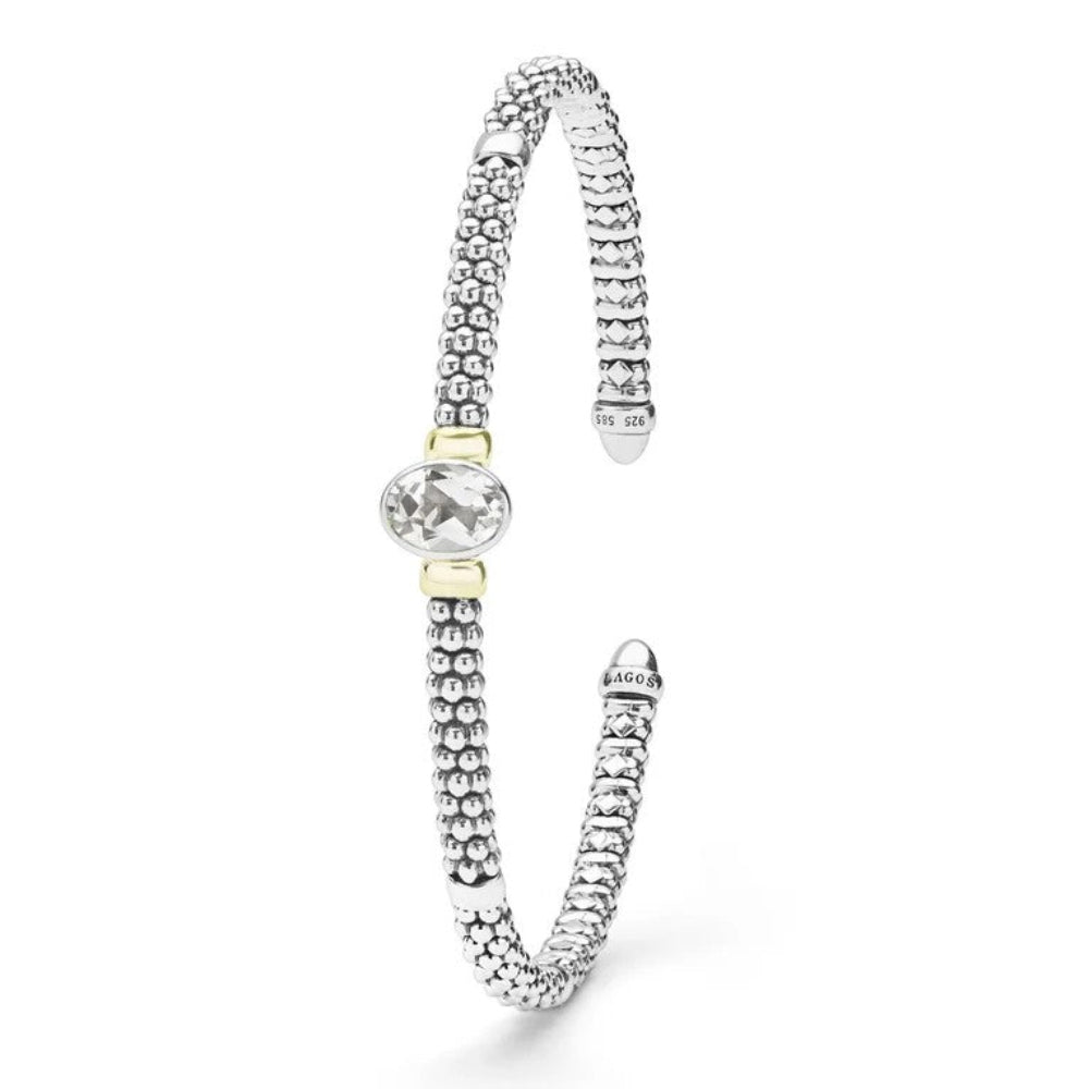 A Sterling silver textured cuff beaded bracelet with a central oval diamond  accented by two small gold-toned beads