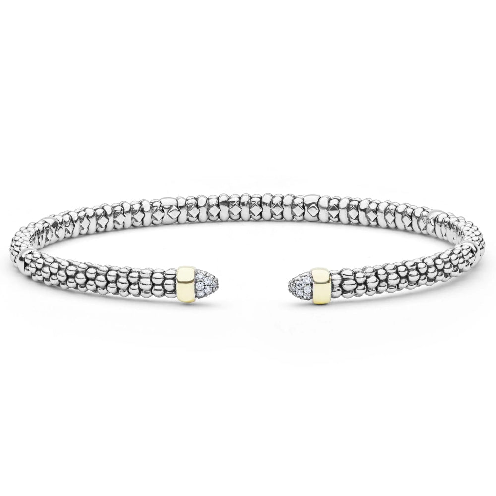 A  sterling silver textured  beaded cuff bracelet with two gold-toned end caps, each accented with diamond cabochons.